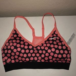 Coral-pink Nike sports bra.